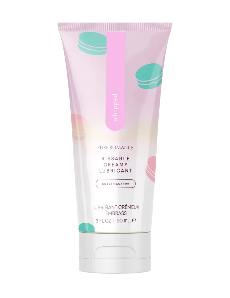 White and pale pink squeezable lubricant tube with teal macaron-style accents and flip-top
