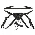 Black strap-on harness kit with front panel, multiple adjustable straps, metal rings and ring
