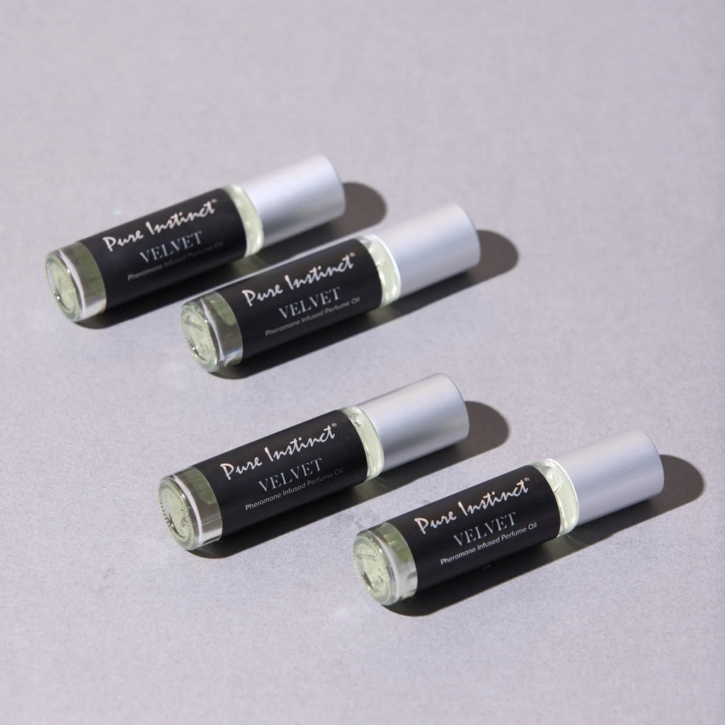 Set of velvet pheromone roll-on bottles with silver caps and black labels
