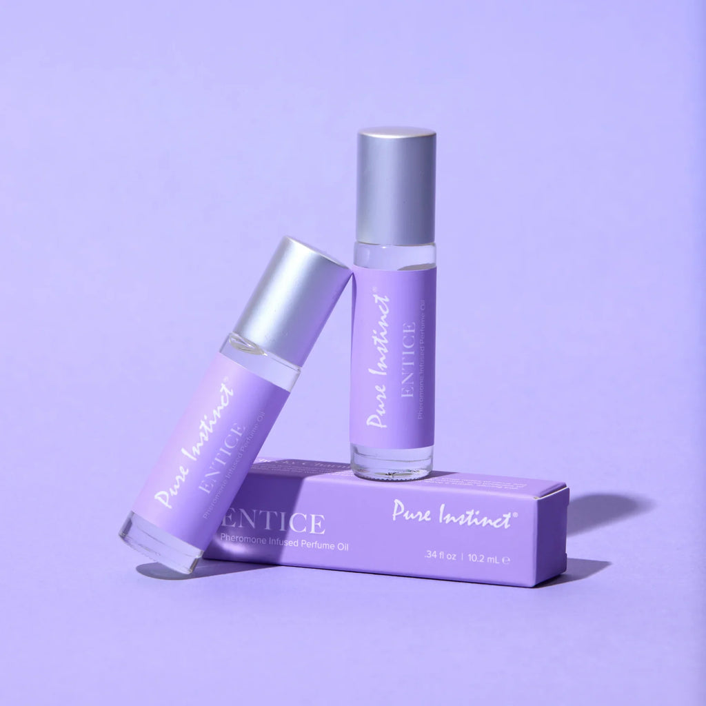 Pheromone roll-on bottle and box with silver cap and purple branding