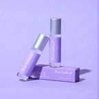 Pheromone roll-on bottle and box with silver cap and purple branding