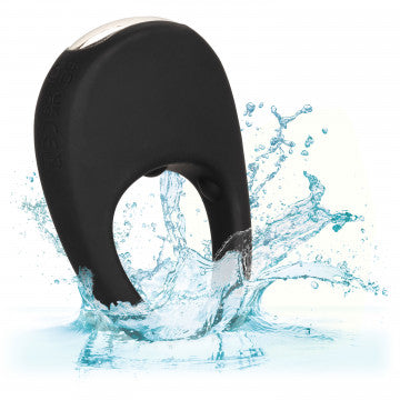 Black silicone pleasure ring with open finger hole, water splash shown behind product