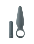 Two gray silicone anal plugs, one with ring handle and one compact plug
