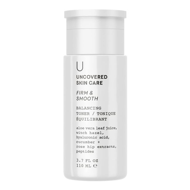 Balancing toner bottle, white cap; firm & smooth, balancing formula text on label.