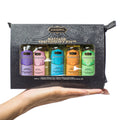 Massage tranquility kit pouch with assorted colored oil bottles in a hand