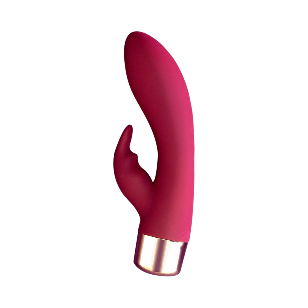 Pink silicone personal massager with curved head and gold-tone battery end