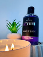 Bubble bath bottle with black cap, purple gel, labeled “Tropical Tease”