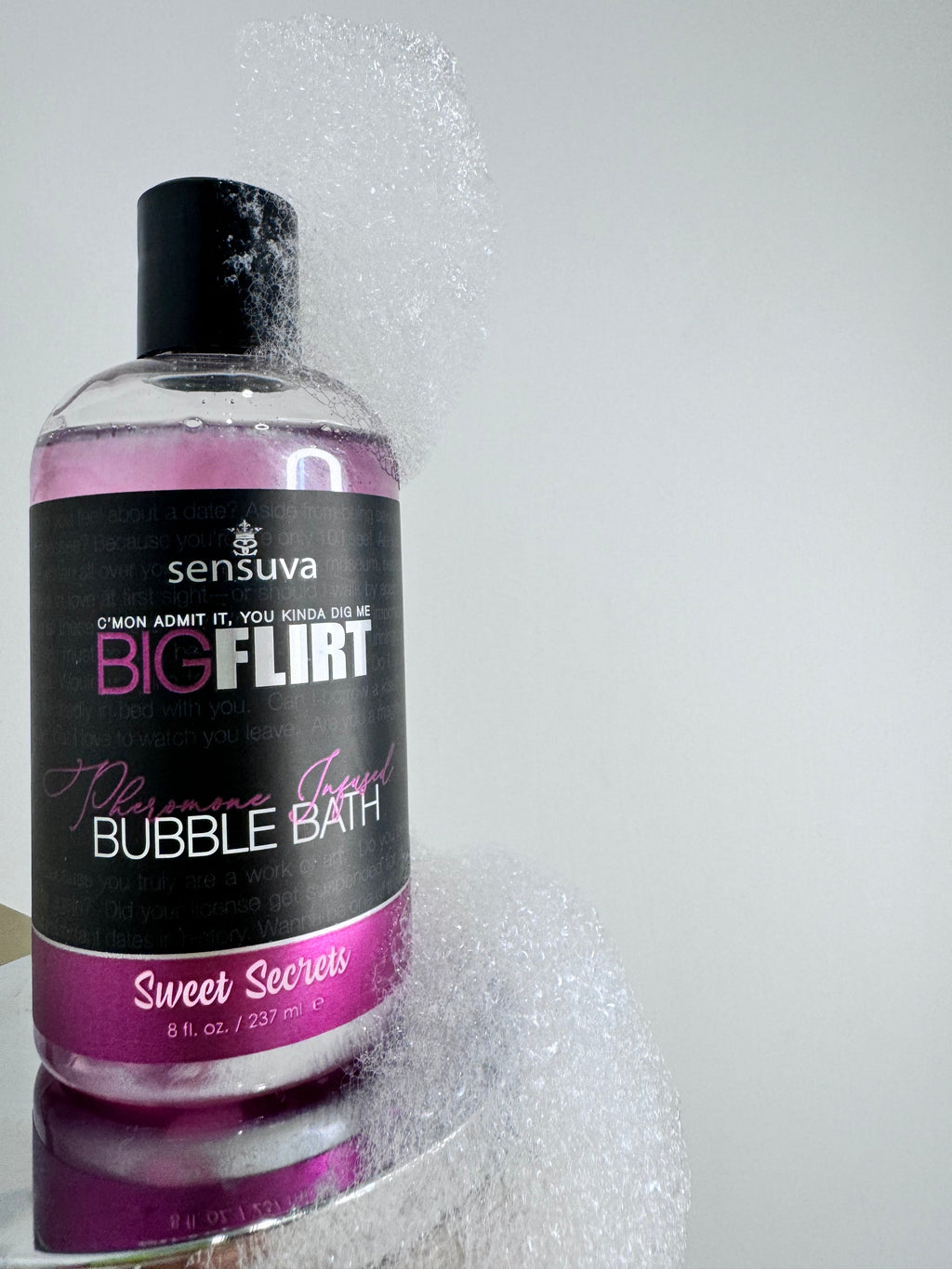 Bubble bath bottle with black cap, purple gel, labeled “Sweet Secrets”