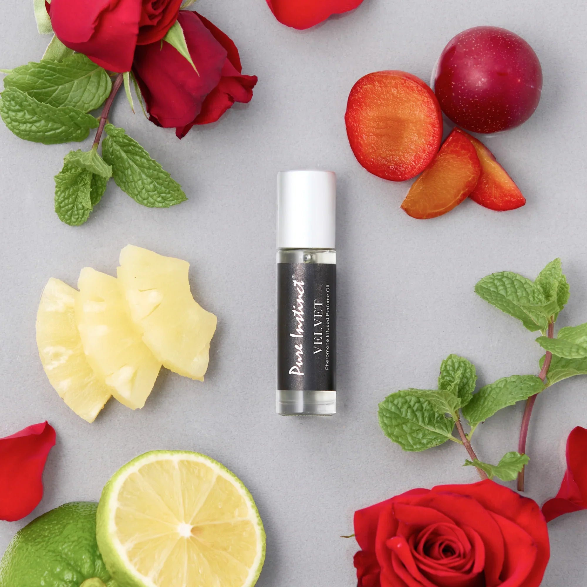 Velvet pheromone roll-on bottle with silver cap and black label