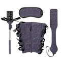 Bondage accessory set: purple patterned blindfold, wrist cuffs, and adjustable strap