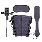 Bondage accessory set: purple patterned blindfold, wrist cuffs, and adjustable strap