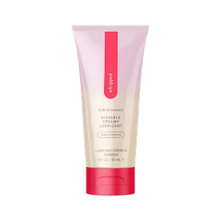 Pink squeezable lubricant tube with vertical red label stripe and red cap base
