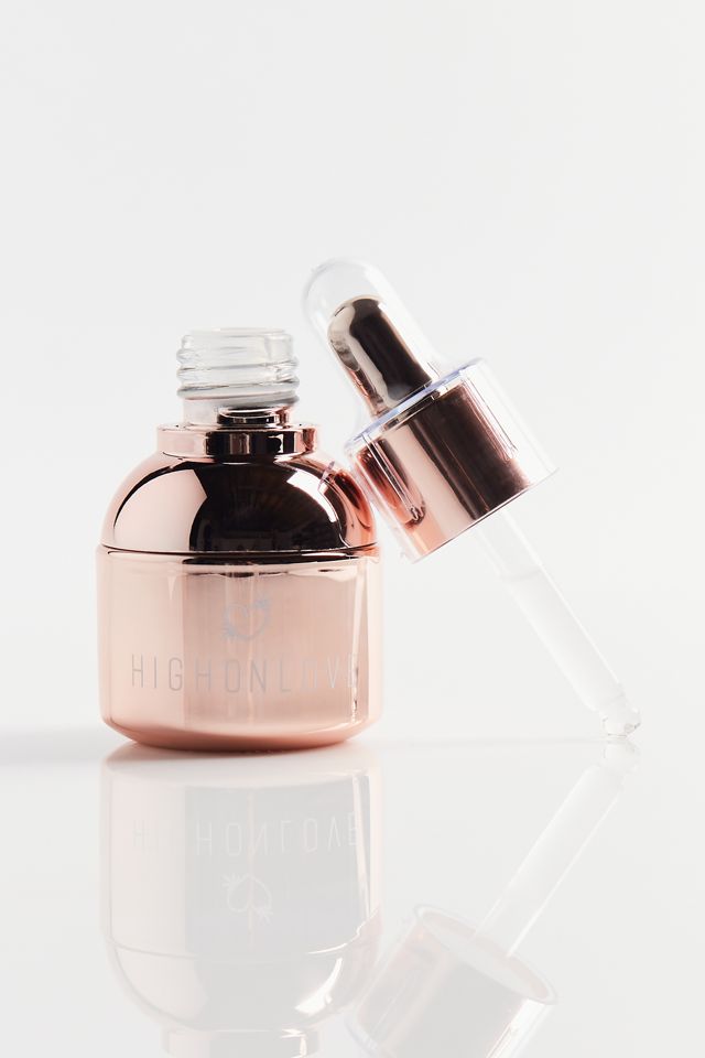 Rose gold oil bottle with open dropper tip