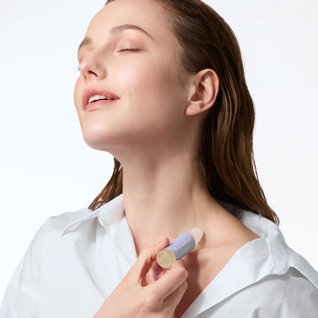 Roll-on applied to neck; silver cap and purple label visible