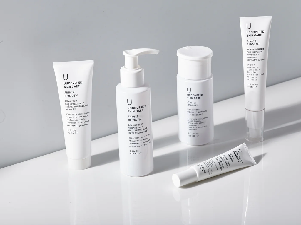 Uncovered Skincare Daily Essentials Kit assorted upright bottles and tubes