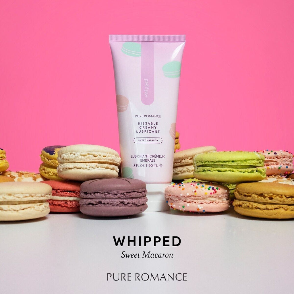 Squeezable lubricant tube in pale pink with macaron illustrations and bright cap base