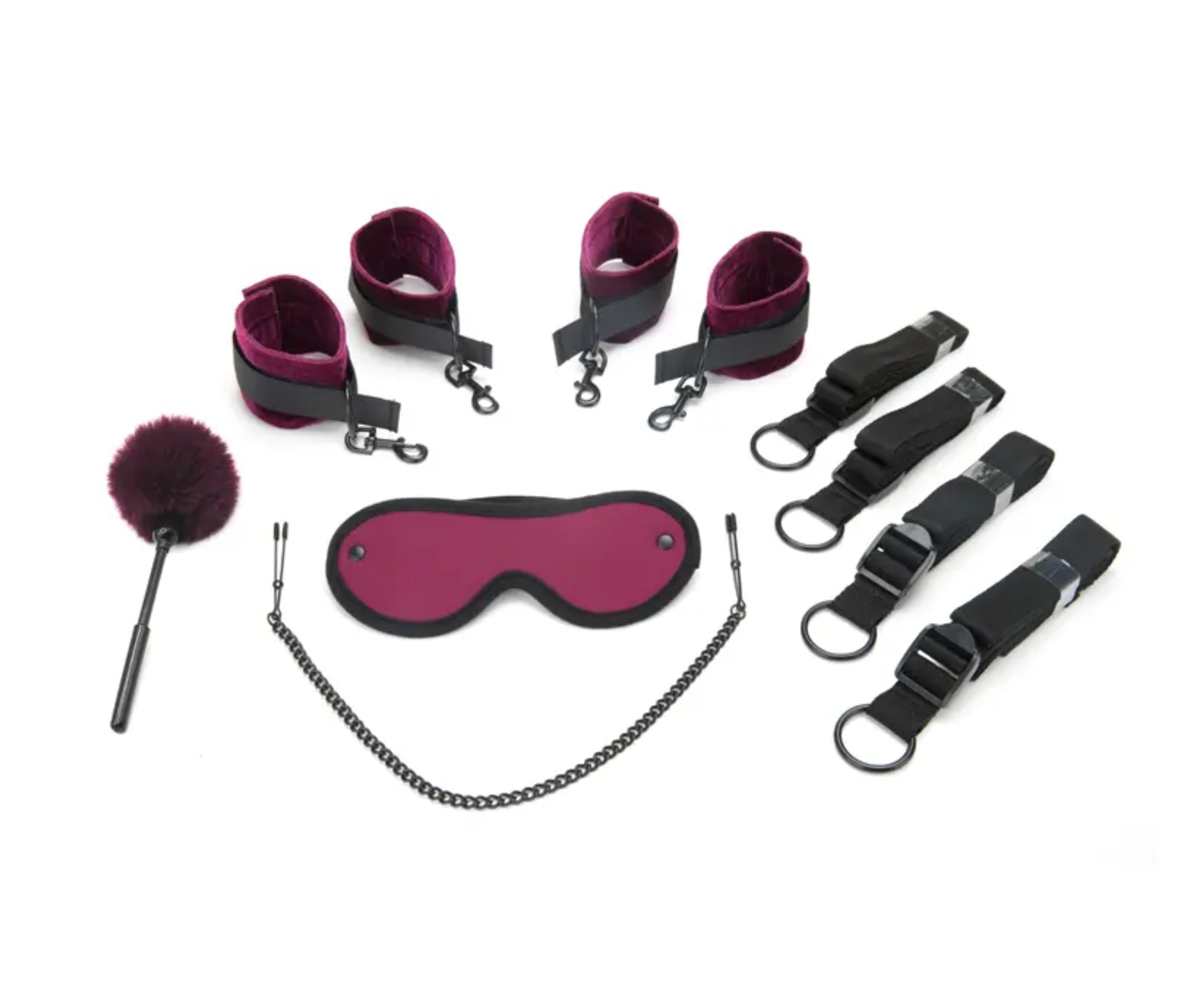 Bondage set with burgundy blindfold, handcuffs, leg cuffs, chain belt, and flogger