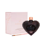 Chocolate body paint in heart-shaped dark bottle with rose-gold cap