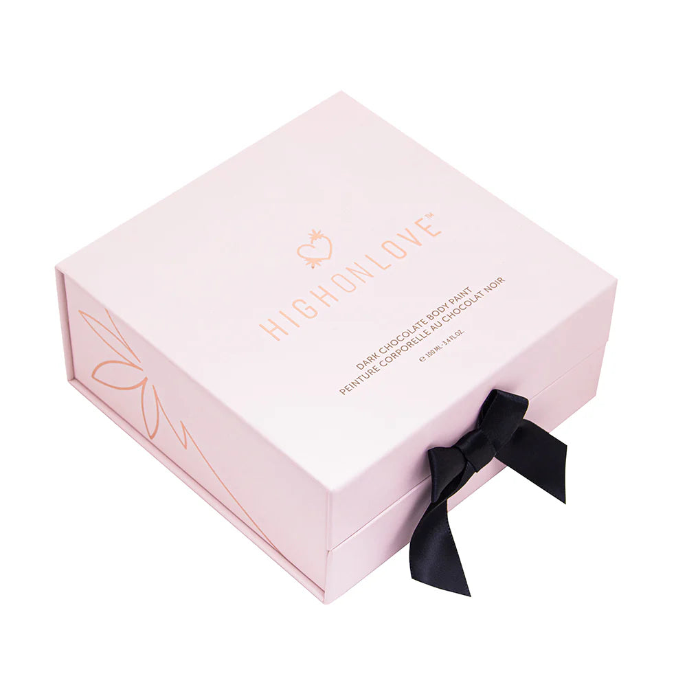 Chocolate body paint gift box with ribbon and heart-shaped dark bottle