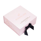 Chocolate body paint gift box with ribbon and heart-shaped dark bottle