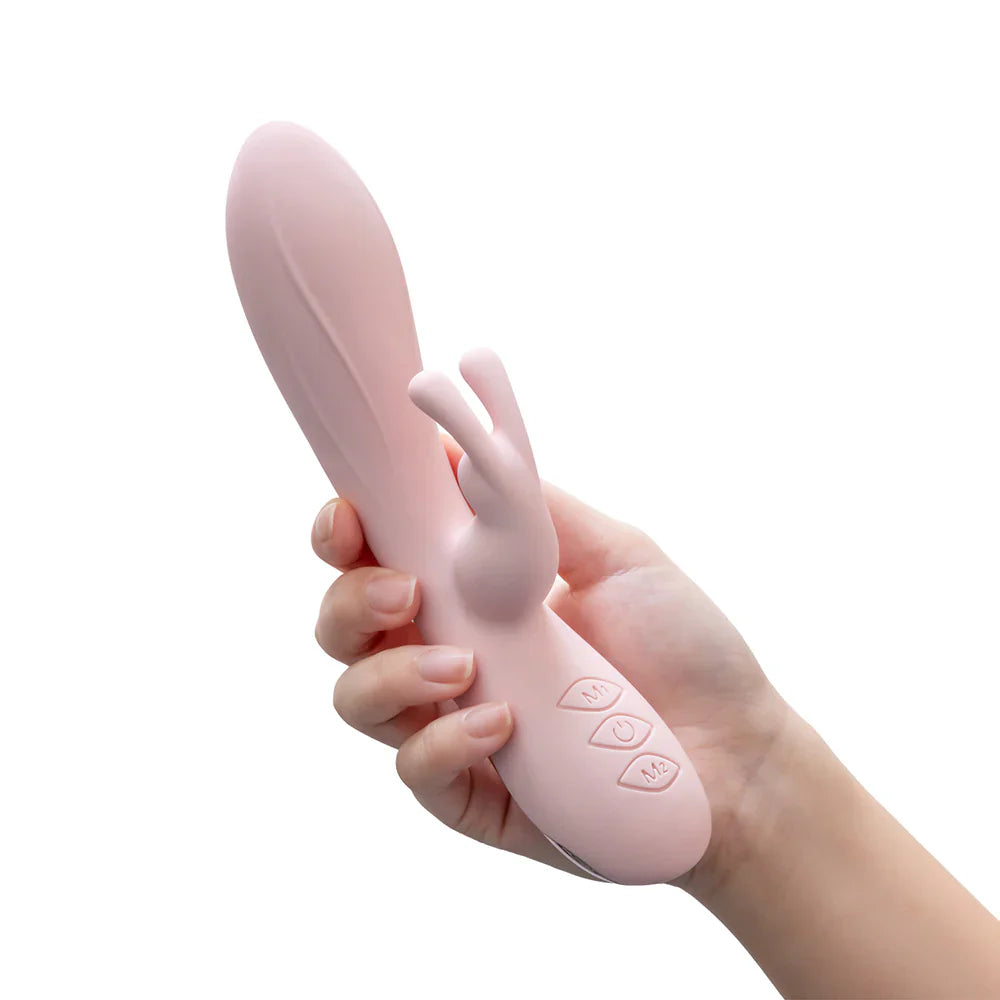 Pink rabbit-style silicone vibrator with control buttons and textured base