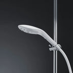 Power shower head releasing a steady water spray from the nozzle plate