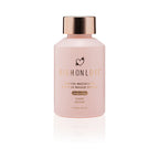 Pink massage oil bottle with gold cap and printed label, front view