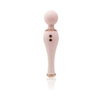 Pink massage applicator tool with rounded top and two dark studs