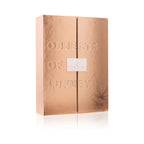 Gold-toned gift box with embossed text and small centered label