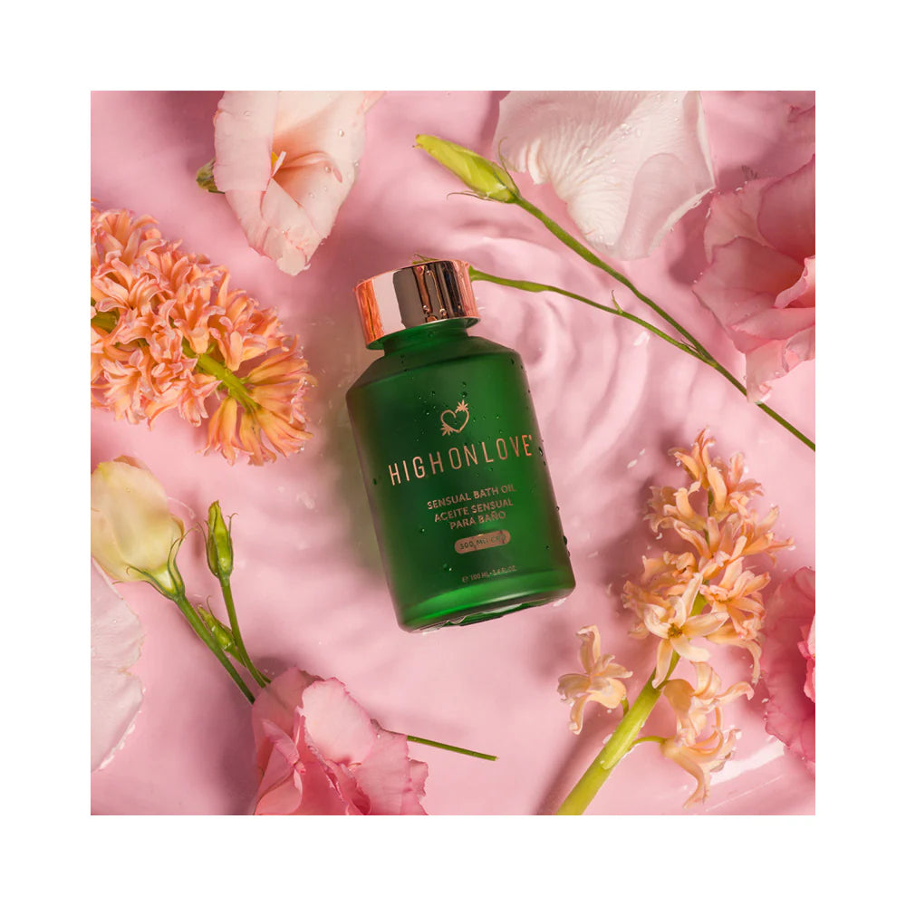 CBD bath and body oil bottle, dark green with pink cap