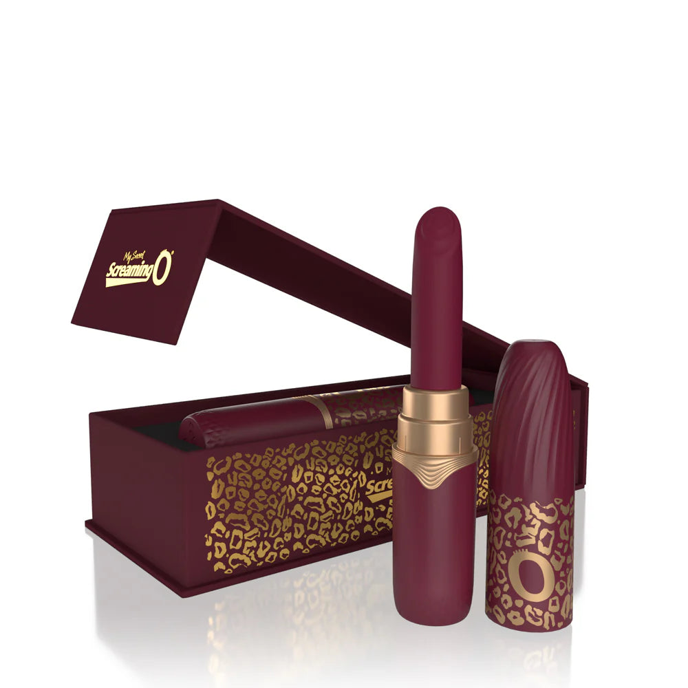 Maroon lipstick with gold cap in open box, plus matching leopard-print tube