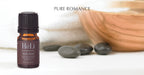 Small HeLi essential oil blend bottle, dark green ribbed cap, amber glass