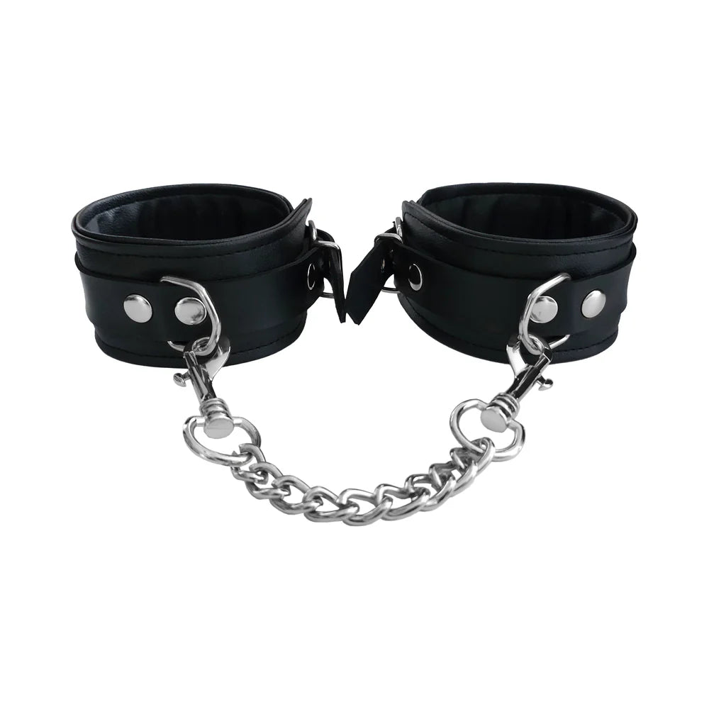 Black ankle cuffs with metal rings, snap closure, and attached chain links