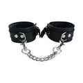 Black ankle cuffs with metal rings, snap closure, and attached chain links