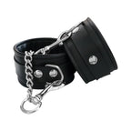 Black ankle cuffs with chain and metal clasp hook, shown at an angle