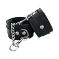 Black vegan wrist cuffs with metal O-ring, chain, and snap clasp