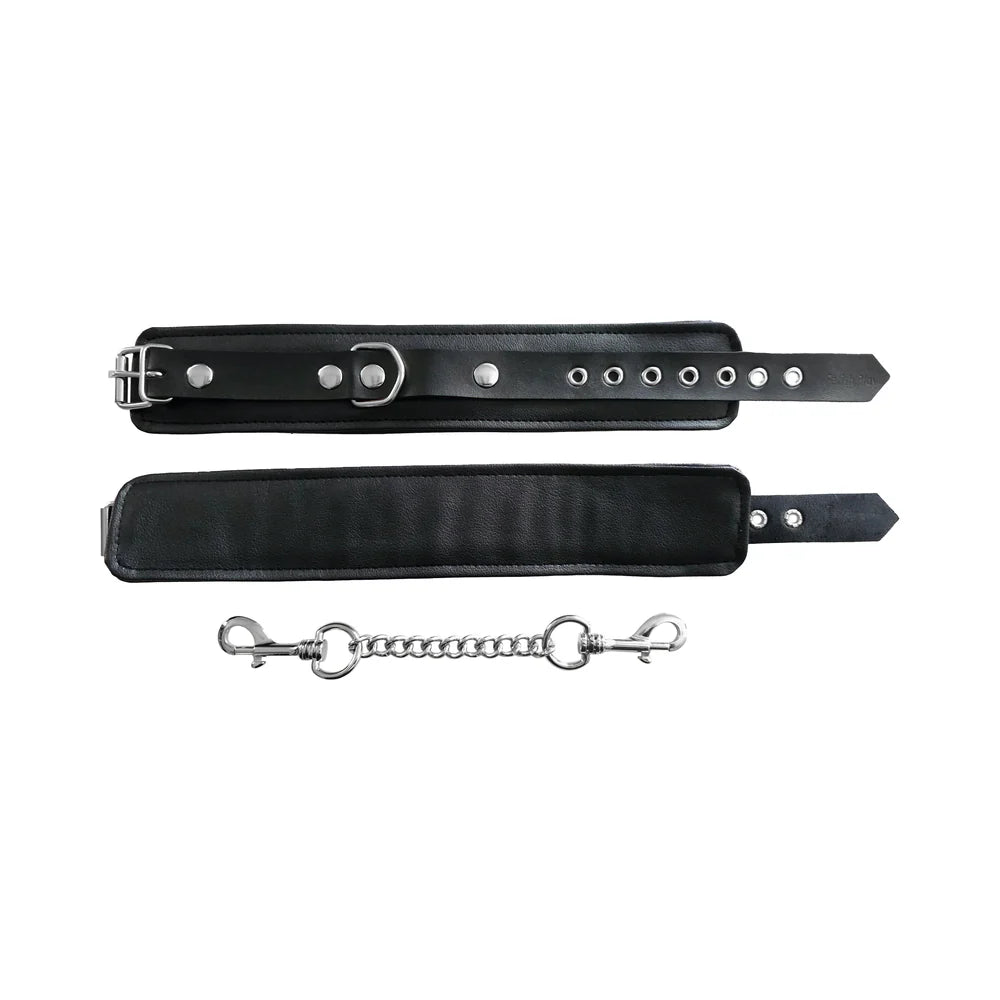 Black ankle cuffs set with buckles, metal studs, and separate chain connector