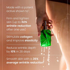 Green firming body oil bottle held in hand, with visible spray droplets and pump top.