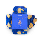 Vulva-shaped pendant necklace on blue gift card with gold-tone chain