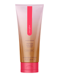 Coco Glow self tanner squeeze tube, rosy-pink cap and center vertical logo stripe