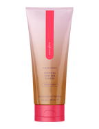 Coco Glow self tanner squeeze tube, rosy-pink cap and center vertical logo stripe