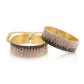 Rhinestone handcuffs with gold chain links and crystal-studded cuffs