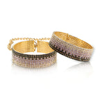 Rhinestone handcuffs with gold chain links and crystal-studded cuffs