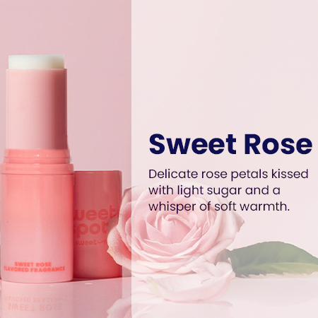 Pink rose flavored fragrance stick beside rose petals