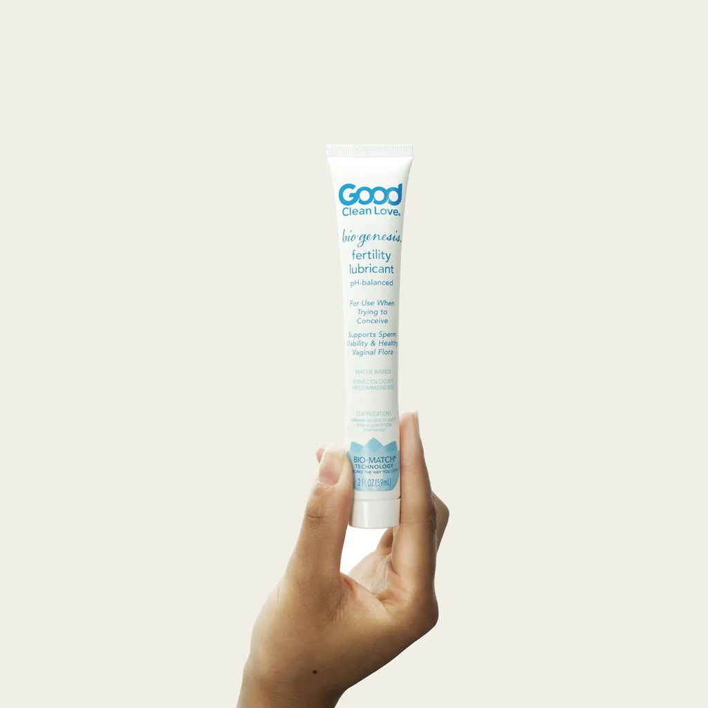 BioGenesis fertility lubricant tube, blue-and-white label held upright in a hand