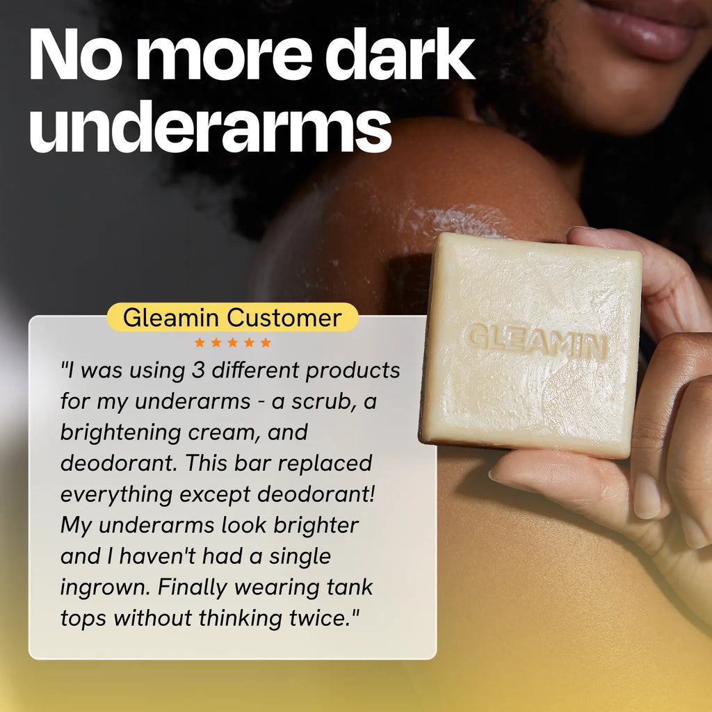 Cream square body bar soap held in hand with visible logo