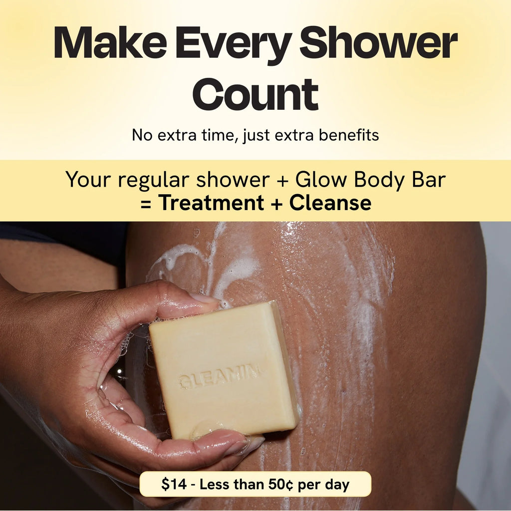 Cream square body bar soap held in hands with suds on skin