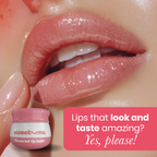 Glossy lips wearing cherry tinted lip balm with lip balm jar shown