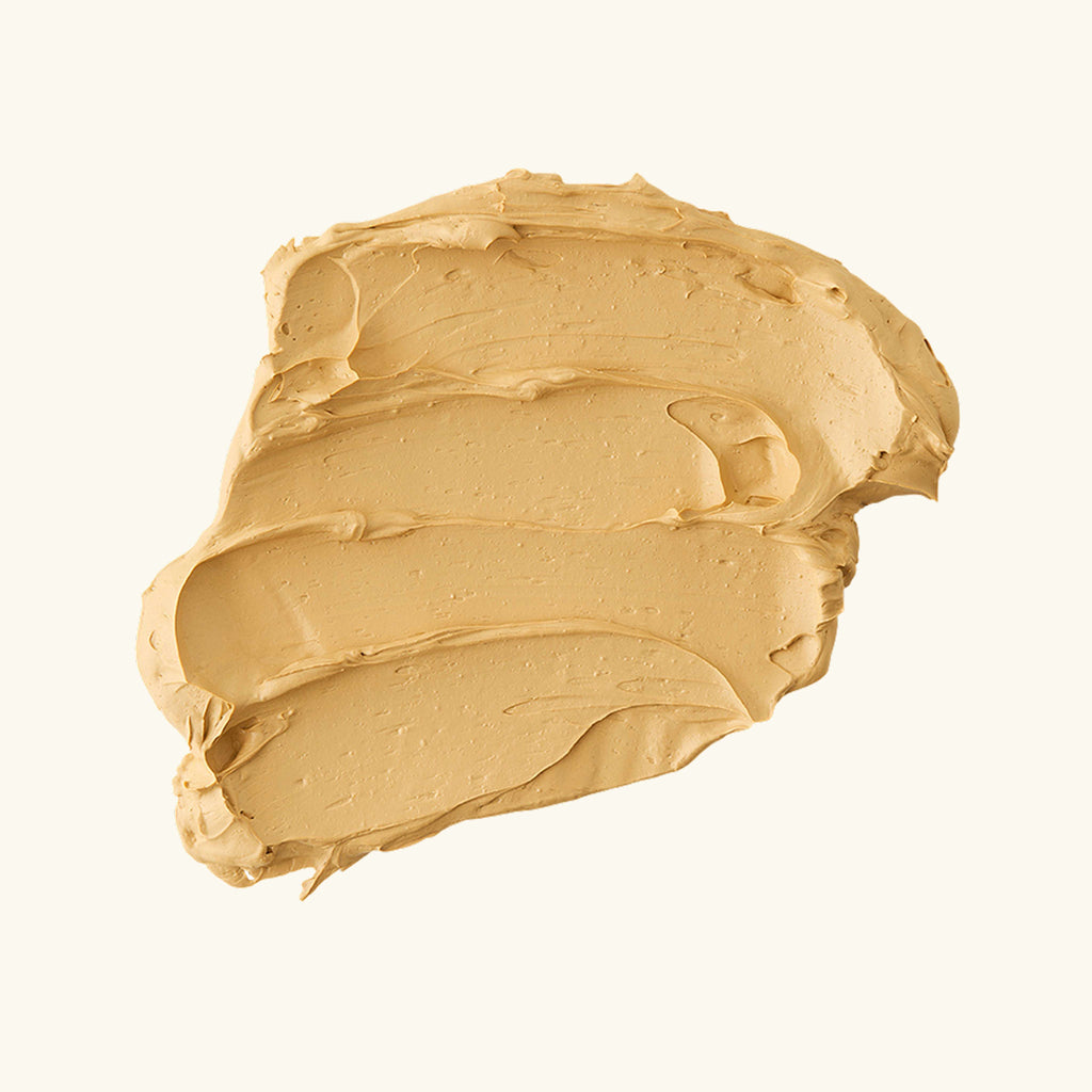 Vitamin C clay mask smear, pale yellow, thick clay texture.