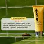 Yellow cleanser tube on tiled surface beside customer star rating callout